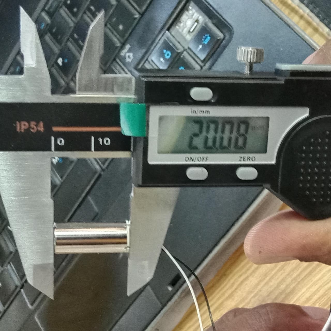 2 Pieces 1 Pair Helicopter Coreless Micro DC Motor with Propeller - being measured by a digital caliper showing a reading of 20.08 mm.