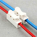 2 Point Quick Connector Cable Clamp Terminal Block Spring Connector Wire - two white plastic connectors with levers clamping red and blue wires.