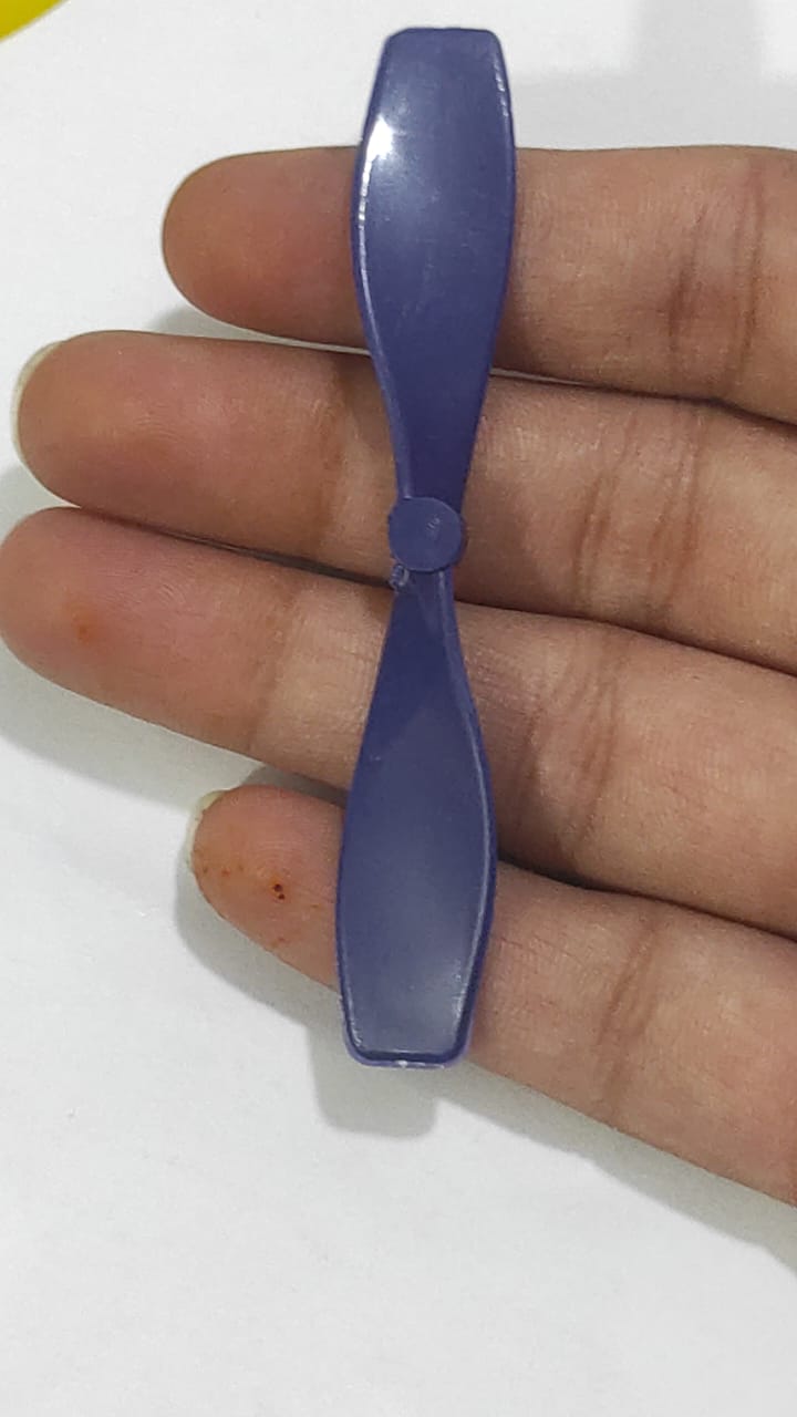 2 Vane Propellor For Small Toy Motor - shown as a close-up of a single purple plastic two-blade propeller held in a hand.