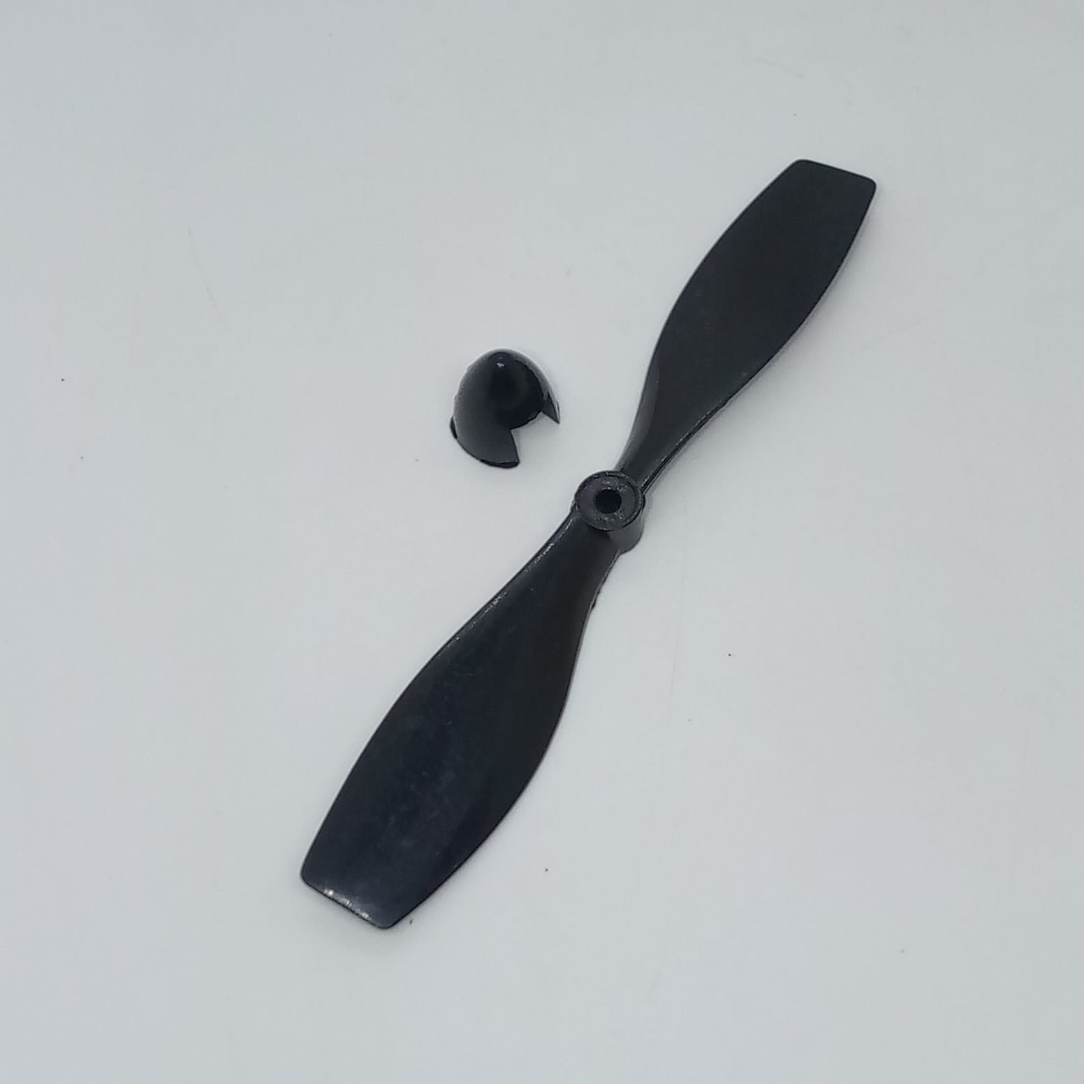 2 Vane Propellor For Small Toy Motor - a black two-blade plastic propeller and a separate matching nose cone cap on a white background.