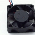 2 Wire 40x40x20mm 12V DC Brushless Fan - a black, square-shaped cooling fan with five blades and two thin red and blue wires extending from the top.