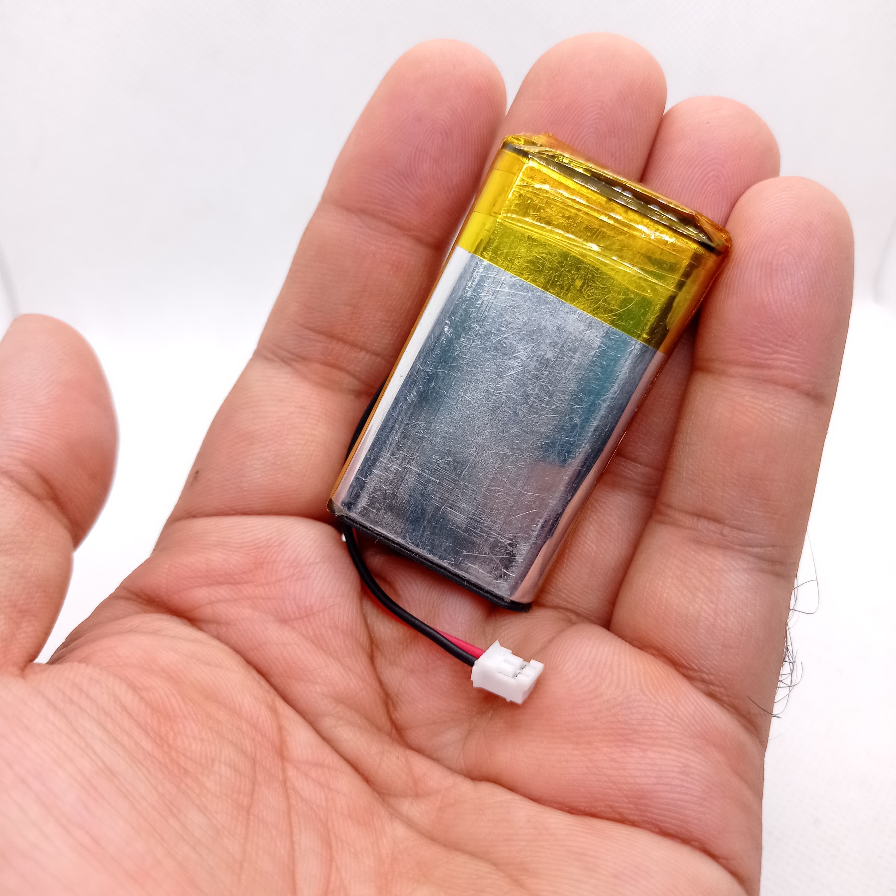 2000mAh 3.7V Lithium-ion battery - a silver rectangular cell with yellow tape and a small white two-pin connector.