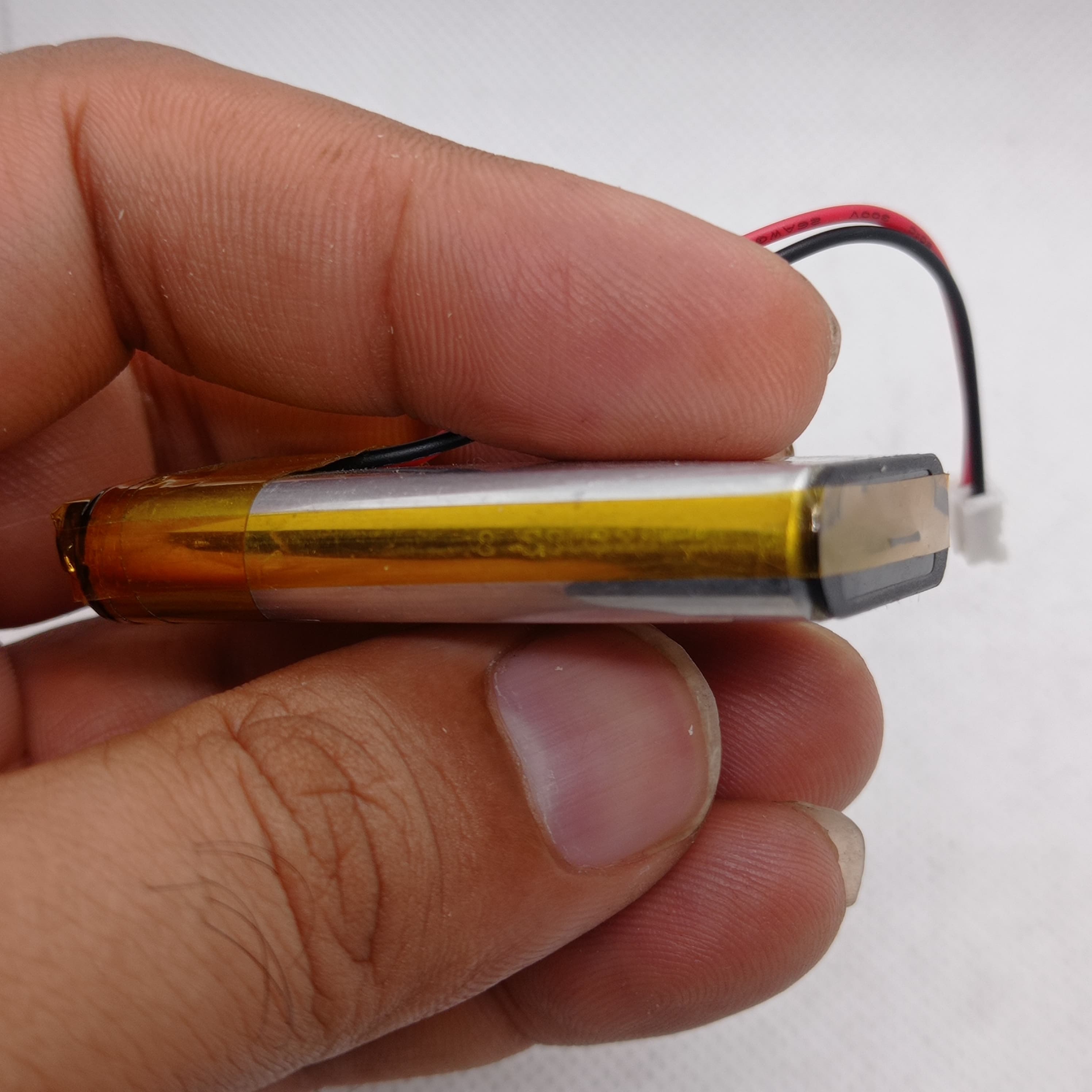 2000mAh 3.7V Lithium-ion battery - a rectangular silver cell wrapped in yellow tape with a two-pin white connector.