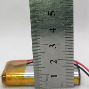 2000mAh 3.7V Lithium-ion battery - shown in a close-up dimension check with a metal ruler measuring its length against the centimeter scale.