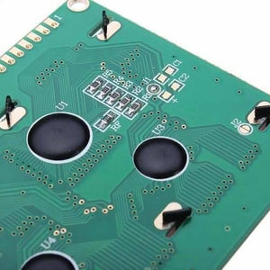 2004A 20x4 Character Blue Color LCD Display For Arduino - a close-up of the green circuit board back featuring black chip-on-board components and surface-mount resistors.
