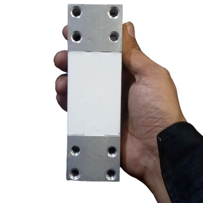 200kg Capacity Strain Guage Load Cell - Gauge Load Cell held in a hand, featuring a white rectangular center section between two silver metal ends with four mounting holes.