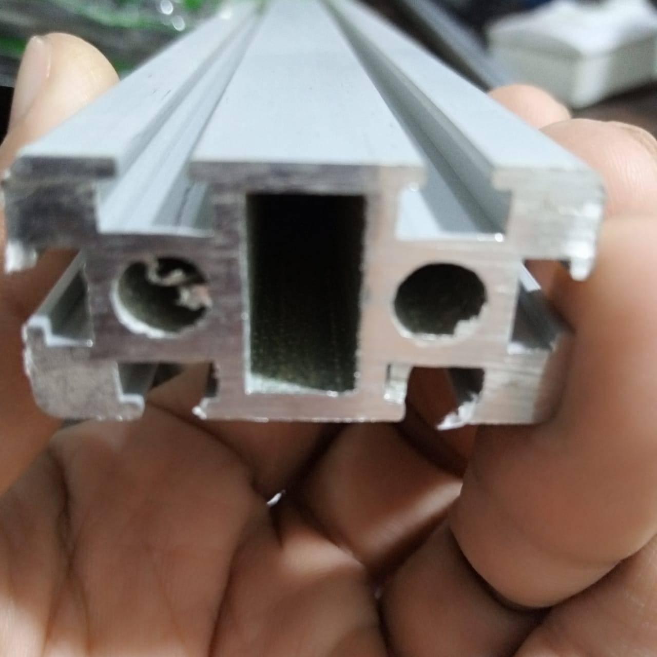 2040 Aluminium Profile Aluminium Extrusion For CNC And 3d Printer 1 Feet - a close-up view of the silver-coloured metal extrusion showing its rectangular cross-section with two circular holes.