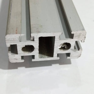 2040 Aluminium Profile Aluminium Extrusion For CNC And 3d Printer 1 Feet - a close-up of the silver metal extrusion showing its rectangular cross-section with T-slots and two circular internal holes.