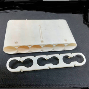 20700A Cell Holder dyson - a white plastic battery housing with five cylindrical slots and a separate matching white plastic spacer bracket.