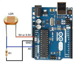 20mm LDR Sensor Light Dependent Resistor Sensor - shown wired to an Arduino Uno board with a resistor and connecting jumper wires.
