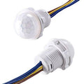20mm Motion Sensor Light Switch - shown as two white, cylindrical sensors with dome-shaped lenses and attached brown, yellow, and blue wires.