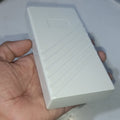 21700 18650 6x Cell Power Bank Case For WiFi Router And Other Devices - shown as a plain white rectangular plastic enclosure held in a hand.