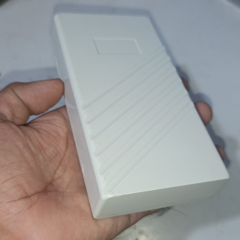 21700 18650 6x Cell Power Bank Case For WiFi Router And Other Devices - shown as a plain white rectangular plastic enclosure held in a hand.