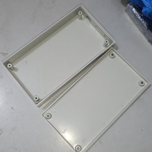 21700 18650 6x Cell Power Bank Case For WiFi Router And Other Devices - the two open halves of a rectangular, off-white plastic enclosure with internal screw mounting pillars.