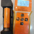 21700 3.7V 3000mA Lithium Ion Cell - 3000mAh Lithium Ion Cell in a black battery holder next to an RC3563 battery tester showing 23.79mΩ and 3.853V on its digital display.