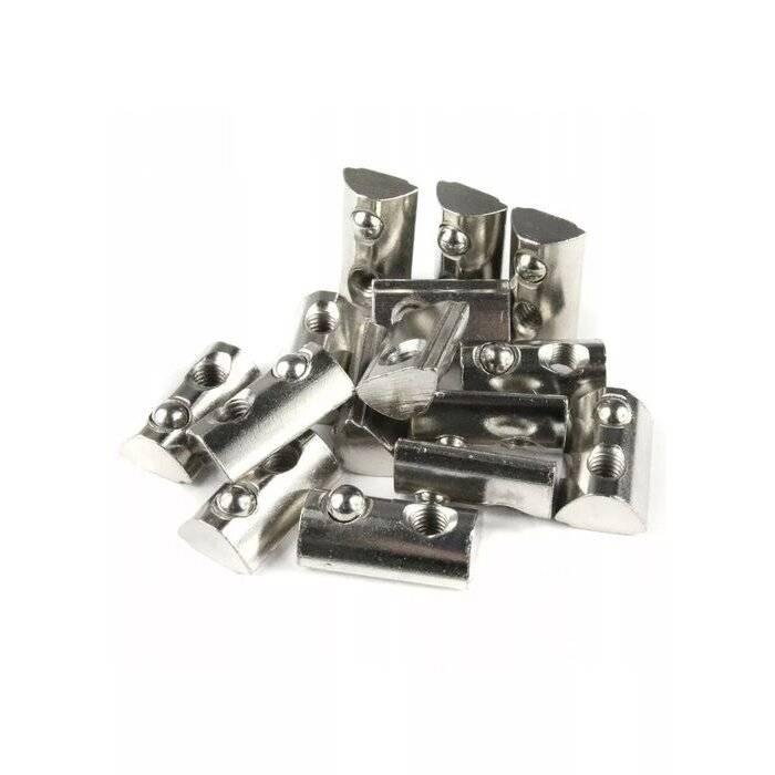 21mm x 13mm x 7mm M8 T Nut, Roll Ball Elastic Nuts For 4040 - shown as a pile of silver-colored metal cylindrical fasteners with integrated ball bearings.