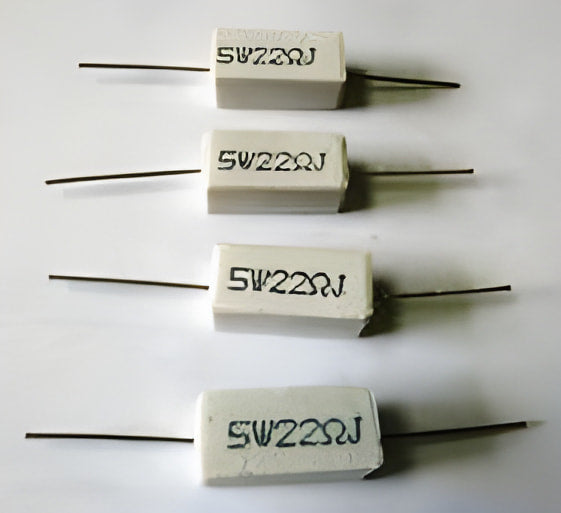 22 Ohm 5W - four rectangular white ceramic cement resistors with axial wire leads arranged in a vertical column against a white background.