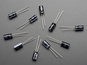 220uF 16V Electrolytic Capacitors - shown as a flat-lay arrangement of ten small, black, cylindrical electronic components with two metal wire leads each.
