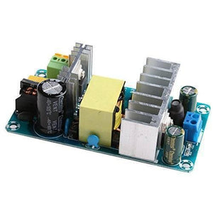 220VAC-24VDC Switching Power Supply Board - a green circuit board with two silver heatsinks, a yellow transformer, black capacitors, and connectors.