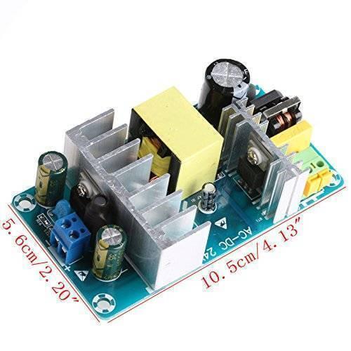 220VAC-24VDC Switching Power Supply Board - a green circuit board with heat sinks, capacitors, a transformer, and two blue and green terminal blocks.