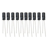 22uF 50V Electrolytic Capacitor - ten identical black cylindrical electrolytic capacitors with two wire leads each, arranged in a horizontal row.