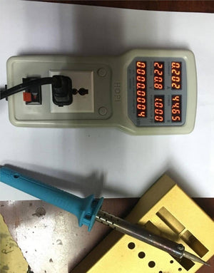 2400W 100V-240V 10A Power Meter Analyzer HP8 - a blue soldering iron plugged into its outlet with a digital display reading 220.8V and 44.65W.