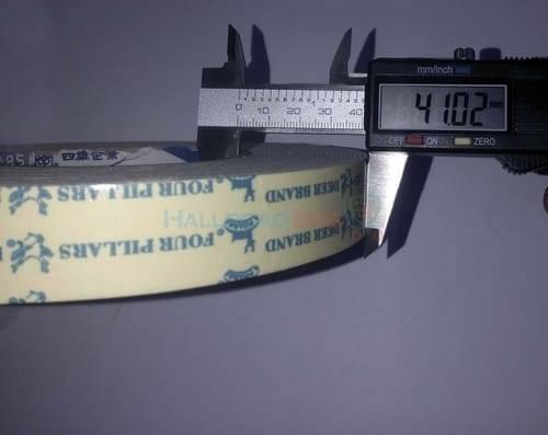 24mm Double Sided Adhesive Tape - with a digital caliper, showing a reading of 41.02 on the LCD screen.