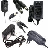 24V 0.5A DC Power Supply Adapter 2.1mm x 5.5mm Plug Used - a collage of black AC power adapters with various plug types and DC barrel connectors.