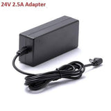 24V 2.5A Adapter AC To DC Switching Power Supply For LED Cctv LCD - a black rectangular AC to DC power supply unit with an attached output cable ending in a right-angle barrel connector.