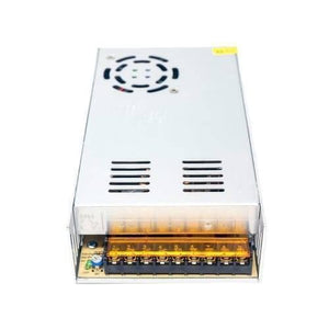 24V 20A Switching Power Supply SMPS - a rectangular silver metal unit with a cooling fan, ventilation slots, and a terminal block with nine screw contacts.