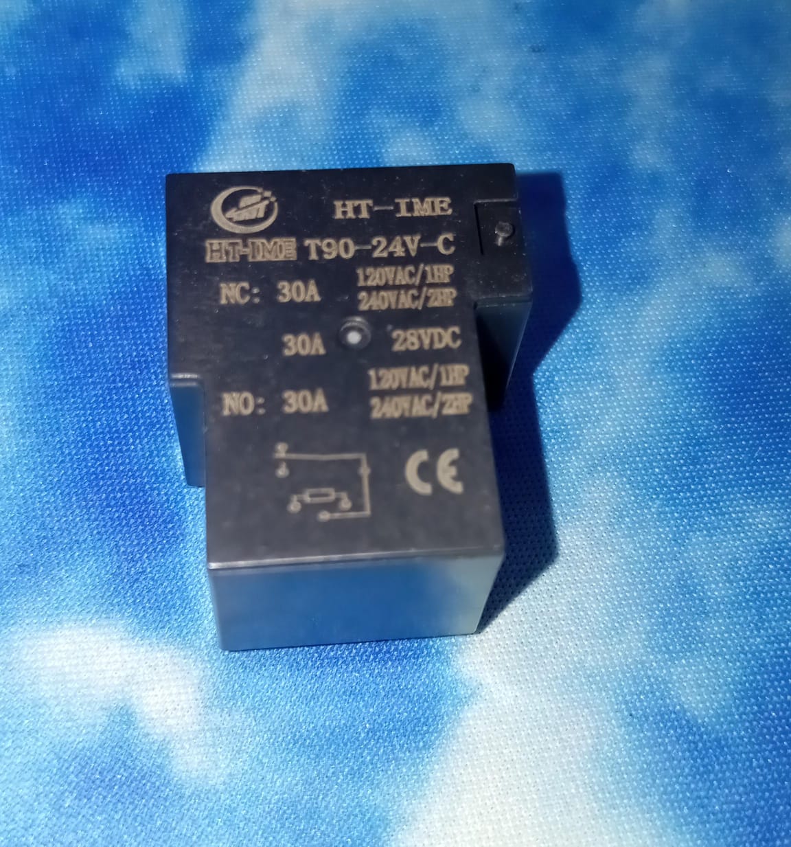 24V DC Coil T90 Power Relay 6 Pin Ht-ime - a black rectangular electronic component with printed technical specifications and a circuit diagram on its face.