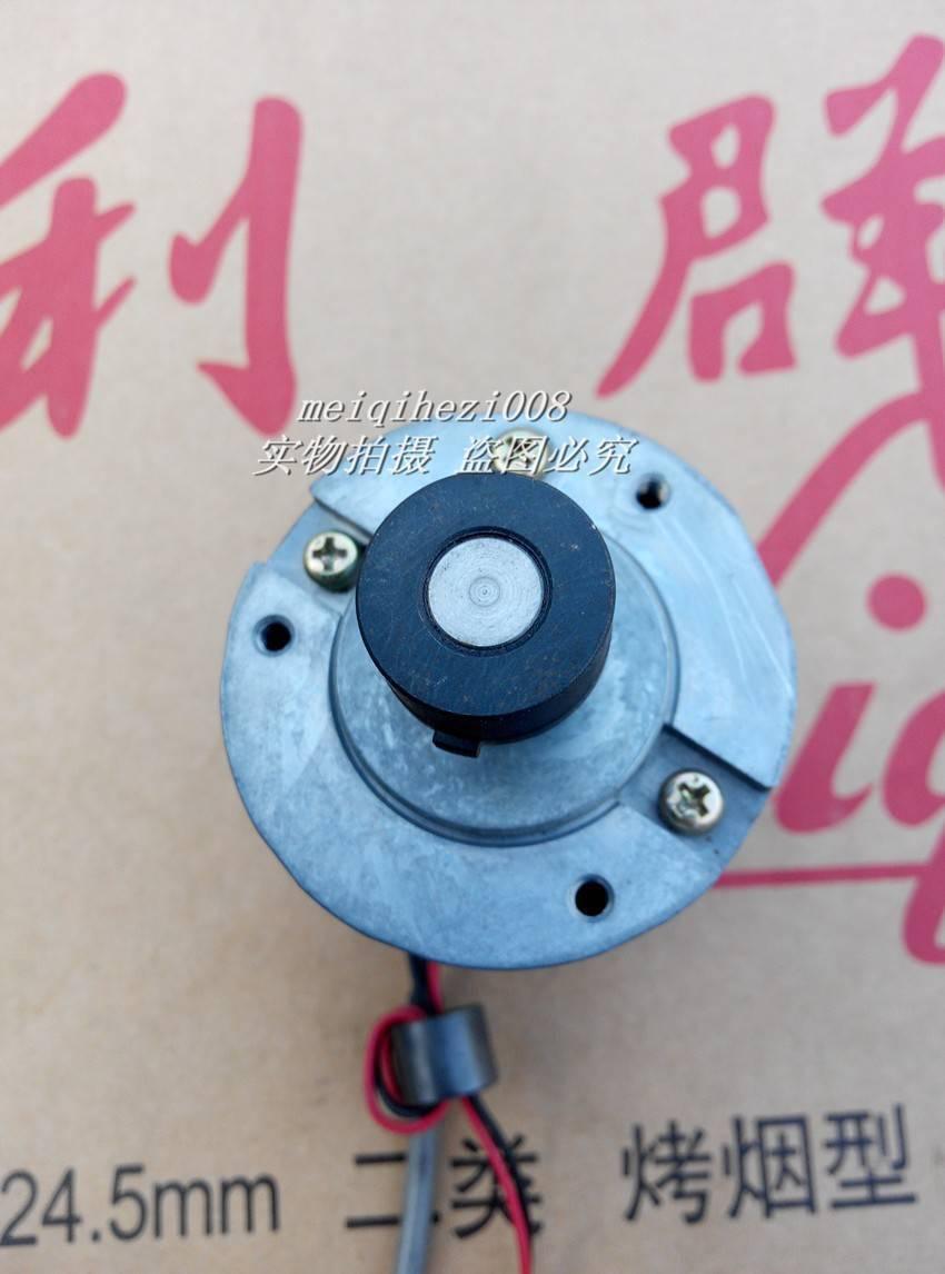 24V Japan Yaskawa Servo DC Motor With Encoder Ugfmed-03SRI11 0V To 27V Maximum - a close-up top view of the circular silver metal housing, black central shaft, and two mounting screws.