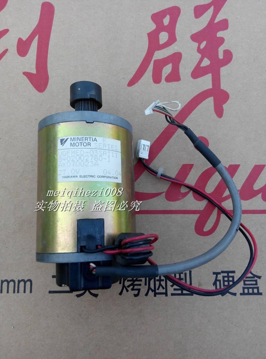 24V Japan Yaskawa Servo DC Motor With Encoder Ugfmed-03SRI11 0V To 27V Maximum - cylindrical gold-toned body, a black gear shaft, and two attached white electrical connectors.
