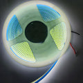 24V Warm White COB Car LED Light Strip For Car Decoration - a coiled, illuminated strip on a circular plastic spool with visible red and black power wires.