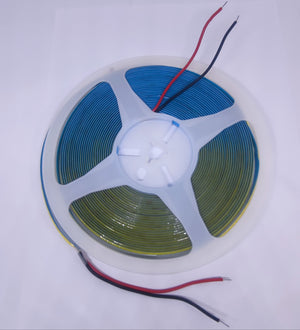 24V Warm White COB Car LED Light Strip For Car Decoration - shown as a coiled strip on a plastic spool with red and black power wires extending from the top and bottom.