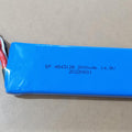 25S 4S 14.8V 2200mAh LiPo Battery - a rectangular blue battery pack with a blue connector and a white balance lead, showing printed text and a date.