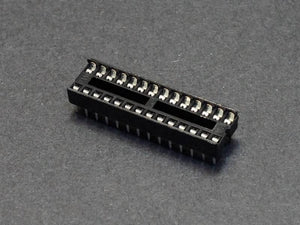 28 Pin DIP IC Socket Base Adaptor Connector - shown as a black, rectangular plastic component with two rows of metal pins on a dark grey background.