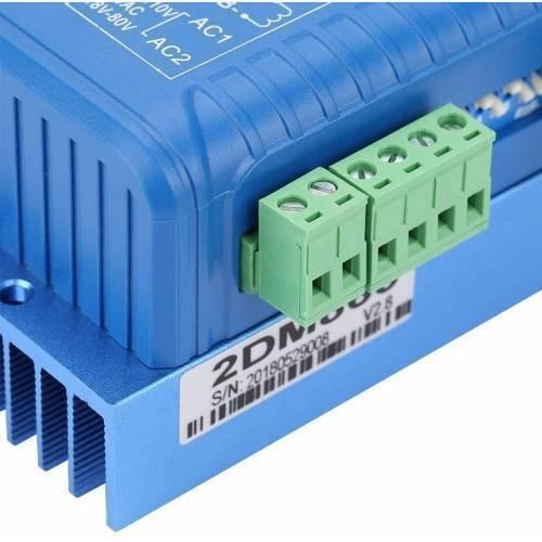 2DM860H 2 Phase NEMA23 NEMA34 Stepper Motor Driver - a blue metal unit with a green screw terminal block and a white label showing the model number and serial number.