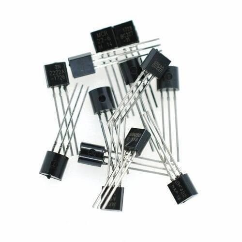 2N2222A Bipolar Junction NPN Transistor - shown as a small pile of black plastic three-pin electronic components with silver metal leads.