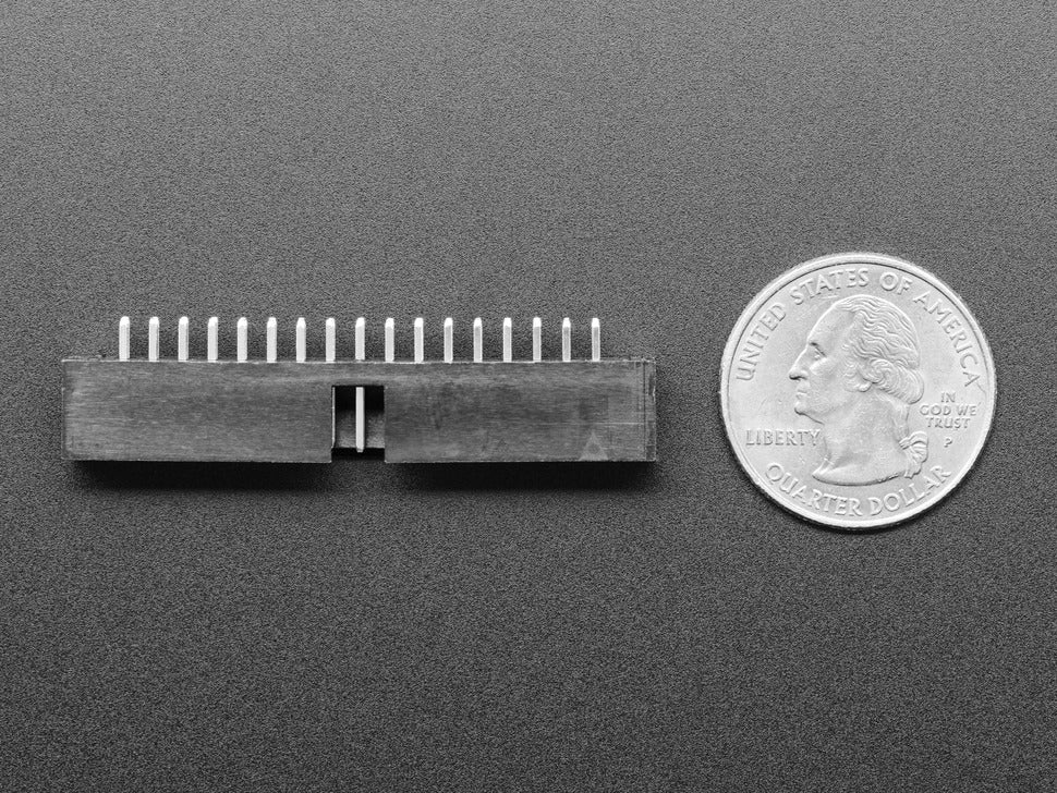 2x17 34 Pin IDC Box Header 0.1 / 2.54mm Pitch - shown as a black rectangular connector with two rows of pins next to a US quarter coin for scale.