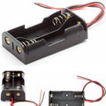 2xaa Battery Cell Holder Square Case Housing - shown from three angles as a black plastic enclosure with metal springs and red and black wire leads.