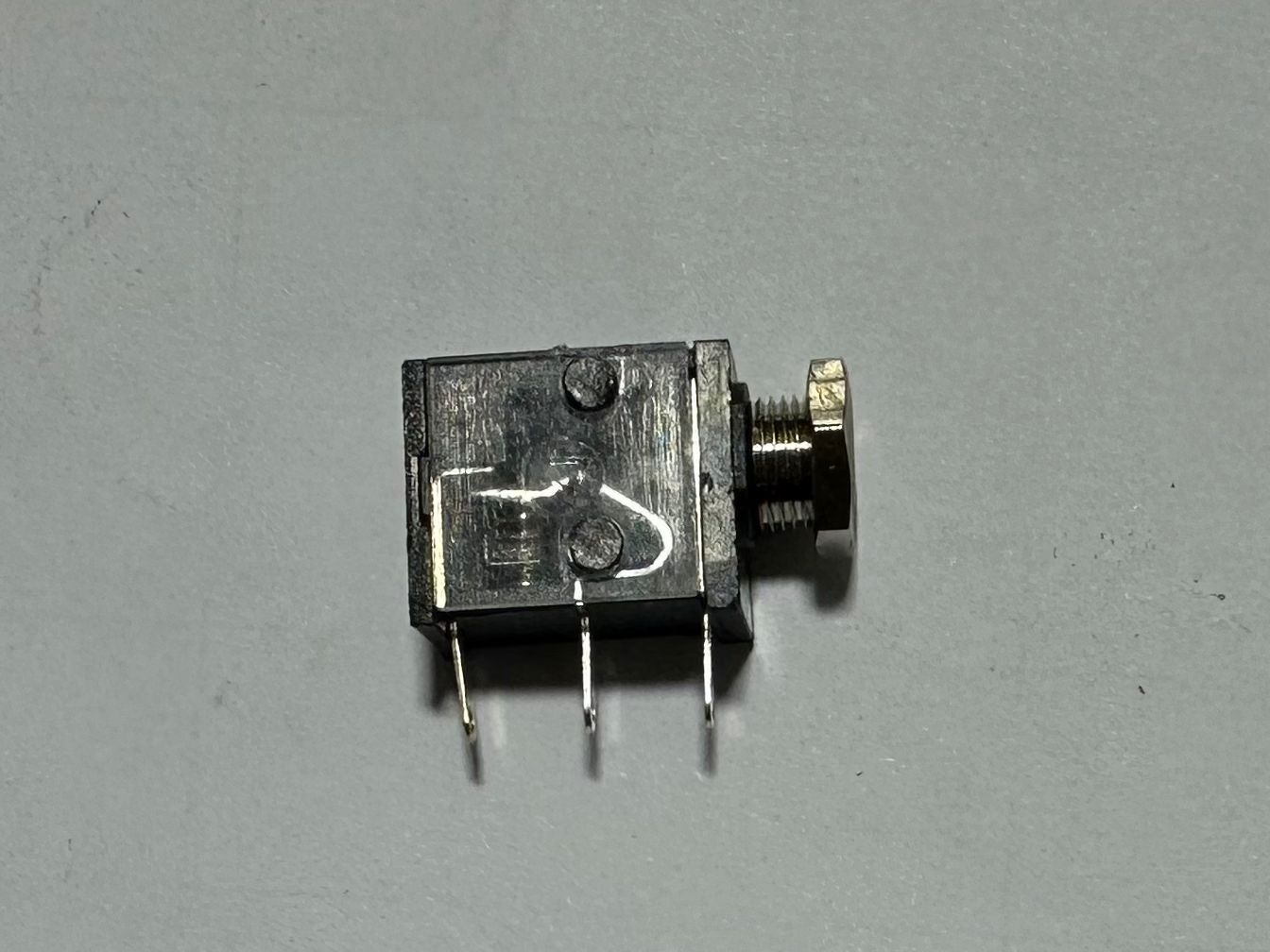 3.5mm Female Stereo Audio Jack Socket - 3-pin PCB Mount Connector - shown as a black, rectangular component with three metal pins and a threaded port.
