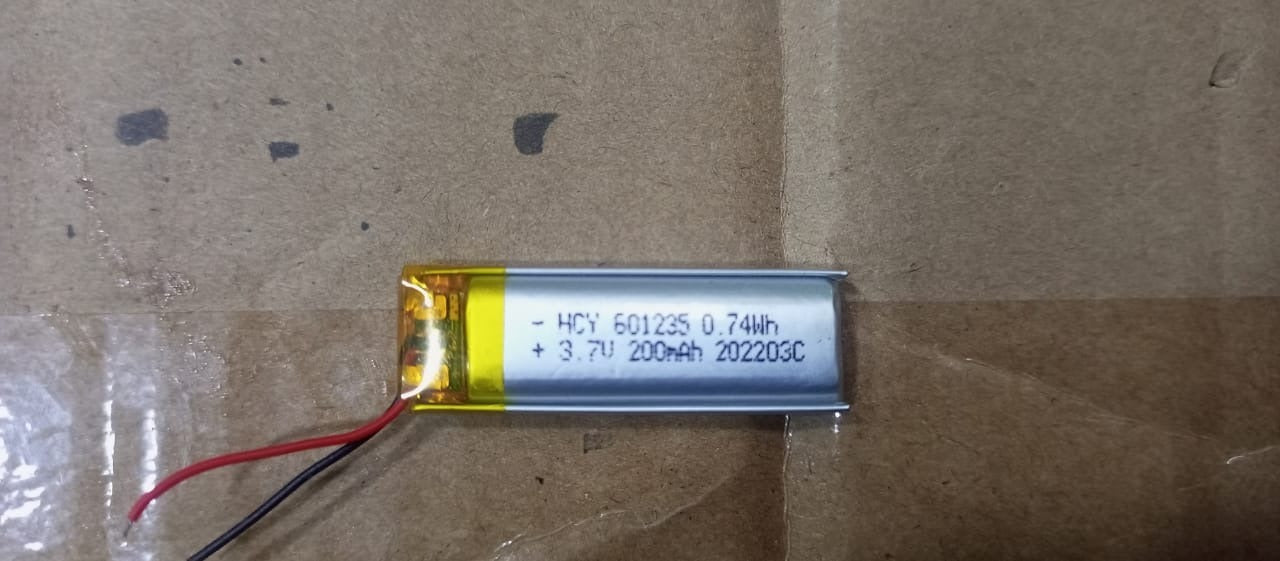 3.7V 200mAh Li-ion Battery (Model: 601235) – Compact Power Solution for Portable Devices - a rectangular silver lithium-ion battery with a yellow protective tape end and red and black wire leads.