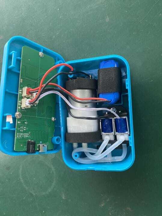 3.7V 2400mA Li Ion Battery Pack 40mm x 30mm x 20mm - shown inside an open blue plastic casing with a circuit board, motor, and tubing connected.