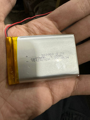 3.7V 2500mAh Lithium-Ion Rechargeable Battery - Li-Po Battery Pack - a rectangular silver Li-Po battery pack held in a hand, featuring red and black wires.