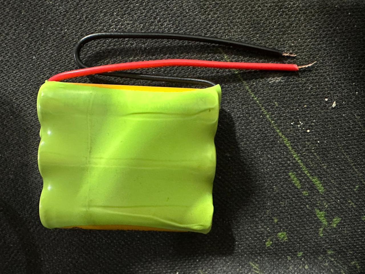 3.7V 700mAh AA Size Rechargeable Battery Pack - NiMH For DIY Projects - a lime green battery pack with two exposed red and black wire leads.