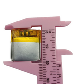 3.7V 70mAh Lithium Ion Li-ion Battery - shown in a close-up view being measured by pink plastic calipers.