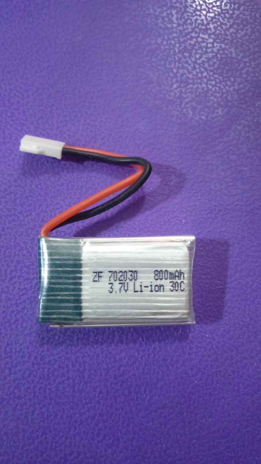 3.7V 800mAh Li-Po Battery 702030 for Drone - a silver rectangular lithium-ion battery with a red and black wire lead ending in a white two-pin connector.