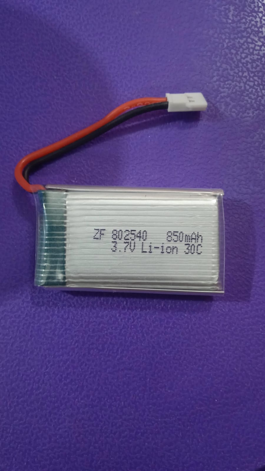 3.7V 850mAh Drone Li-ion Battery Without JST Connector For Syma X5c X5sw And Other Drone Size: 44*25*8.5 - a silver rectangular battery with red and black wires ending in a white connector, showing printed text on its side.