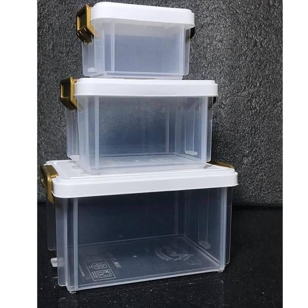 3 Pcs Stackable Smart Storage Containers Boxes For Jewellery, Makeup, Tools, Food, Office Use Organizer Box - show three clear rectangular plastic containers with white lids and gold-coloured side latches stacked.